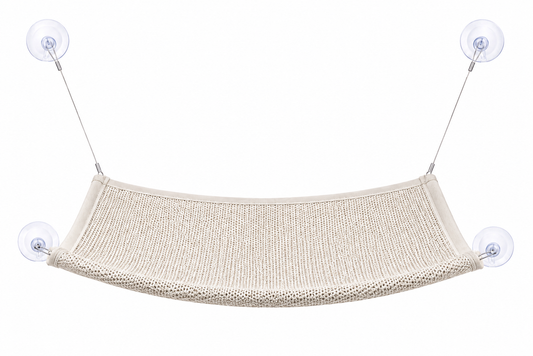 Beige hammock suspended by two suction cups against a white background