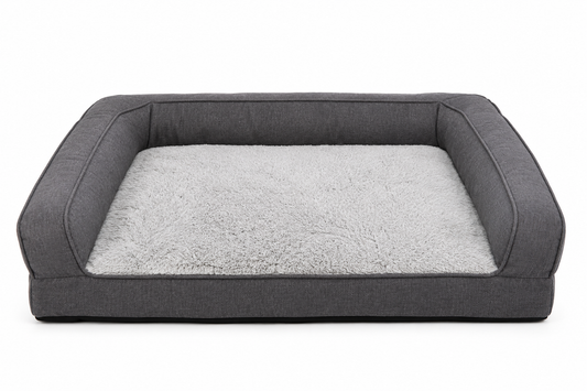 Elevated gray dog bed with plush interior lining and bolstered sides
