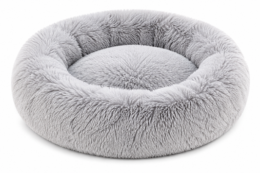 Round, fluffy, light gray pet bed with a soft, plush texture and high sides